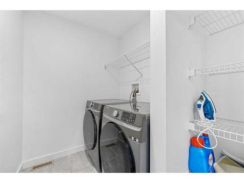 15 Walcrest Row Se, Calgary, AB - Indoor Photo Showing Laundry Room