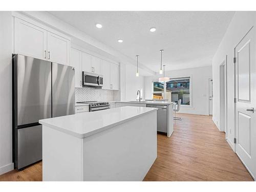 15 Walcrest Row Se, Calgary, AB - Indoor Photo Showing Kitchen With Stainless Steel Kitchen With Upgraded Kitchen