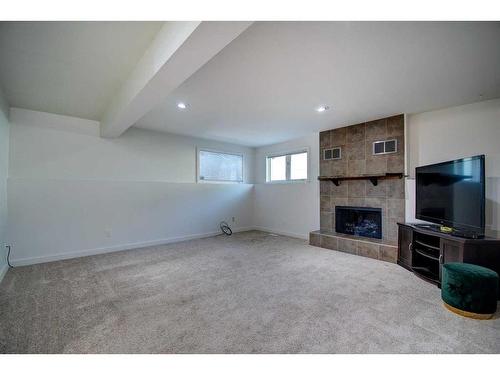 40 Strathearn Rise Sw, Calgary, AB - Indoor With Fireplace