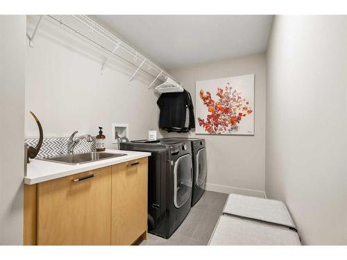 49 Westmore Park Sw, Calgary, AB - Indoor Photo Showing Laundry Room