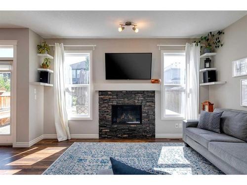 93 Legacy Manor Se, Calgary, AB - Indoor Photo Showing Living Room With Fireplace