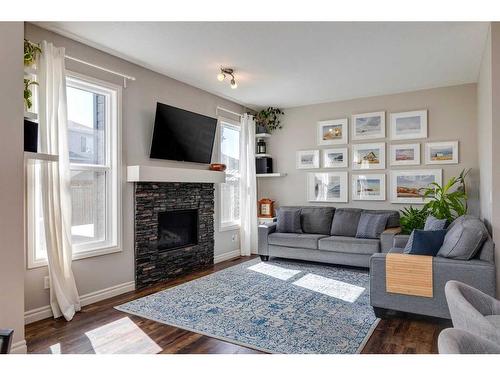 93 Legacy Manor Se, Calgary, AB - Indoor Photo Showing Living Room With Fireplace