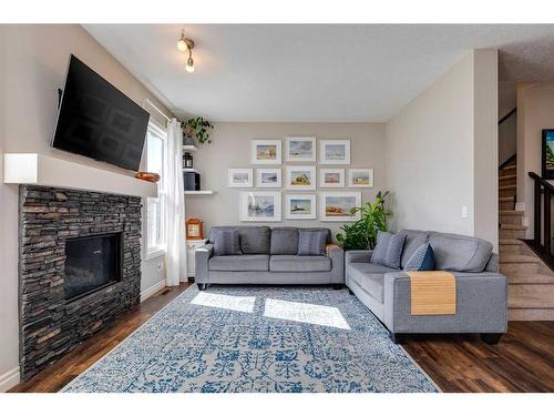 93 Legacy Manor Se, Calgary, AB - Indoor Photo Showing Living Room With Fireplace