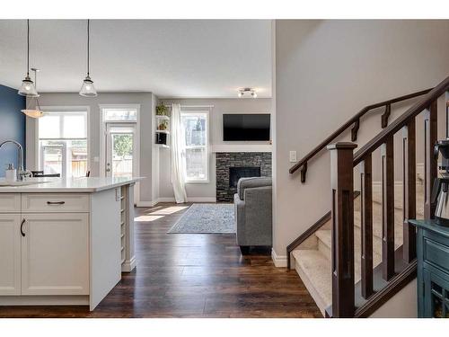 93 Legacy Manor Se, Calgary, AB - Indoor Photo Showing Other Room With Fireplace