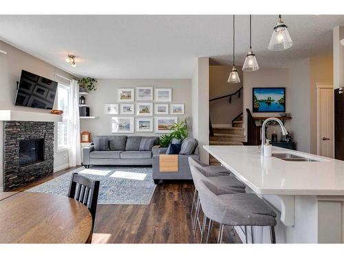 93 Legacy Manor Se, Calgary, AB - Indoor Photo Showing Living Room With Fireplace