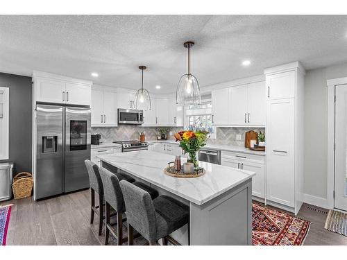 16 Sun Valley Drive Se, Calgary, AB - Indoor Photo Showing Kitchen With Stainless Steel Kitchen With Upgraded Kitchen