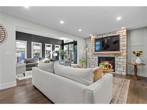 16 Sun Valley Drive Se, Calgary, AB - Indoor Photo Showing Living Room With Fireplace