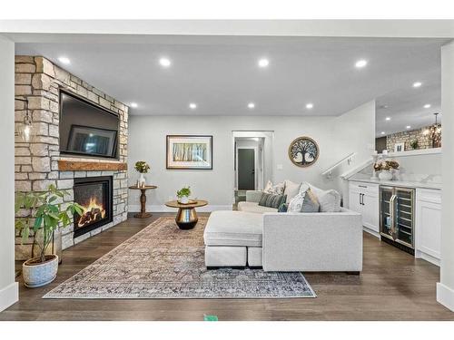 16 Sun Valley Drive Se, Calgary, AB - Indoor Photo Showing Living Room With Fireplace