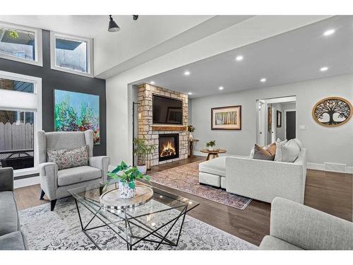 16 Sun Valley Drive Se, Calgary, AB - Indoor Photo Showing Living Room With Fireplace