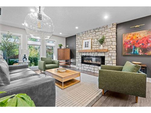 16 Sun Valley Drive Se, Calgary, AB - Indoor Photo Showing Living Room With Fireplace