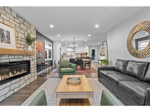 16 Sun Valley Drive Se, Calgary, AB - Indoor Photo Showing Living Room With Fireplace