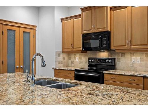 200 Prestwick Manor Se, Calgary, AB - Indoor Photo Showing Kitchen With Double Sink