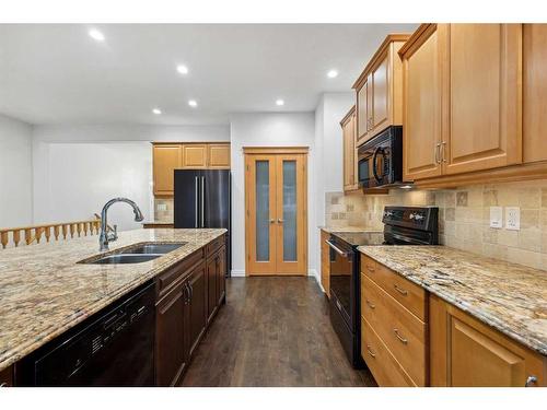 200 Prestwick Manor Se, Calgary, AB - Indoor Photo Showing Kitchen With Double Sink