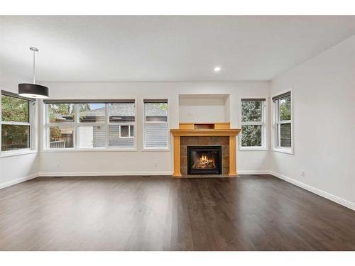 200 Prestwick Manor Se, Calgary, AB - Indoor Photo Showing Living Room With Fireplace