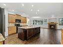 200 Prestwick Manor Se, Calgary, AB  - Indoor Photo Showing Kitchen With Fireplace With Stainless Steel Kitchen With Upgraded Kitchen 