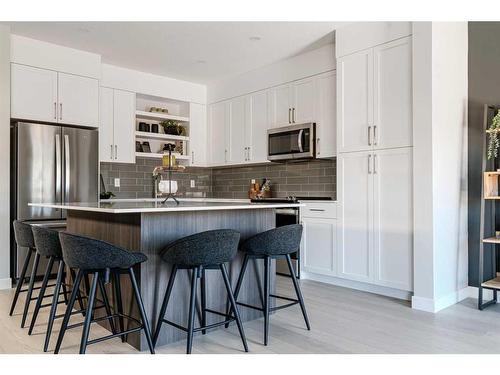 179 Greenwich Drive Nw, Calgary, AB - Indoor Photo Showing Kitchen With Upgraded Kitchen