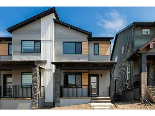 82 Edith Green Nw, Calgary, AB - Outdoor With Deck Patio Veranda With Facade