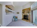 66-23 Glamis Drive Sw, Calgary, AB  - Indoor With Fireplace 