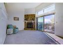 66-23 Glamis Drive Sw, Calgary, AB  - Indoor With Fireplace 