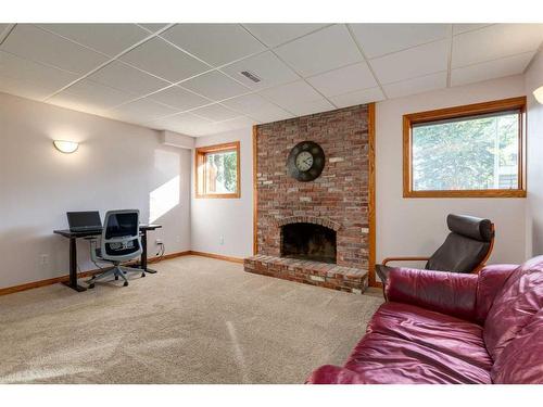 1120 Lake Christina Place Se, Calgary, AB - Indoor Photo Showing Living Room With Fireplace