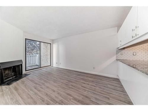 13-3015 51 Street Sw, Calgary, AB - Indoor With Fireplace