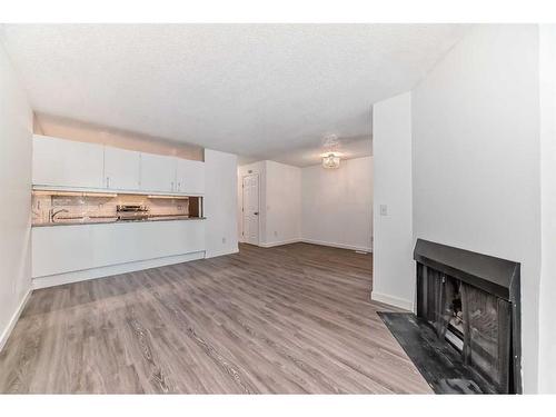 13-3015 51 Street Sw, Calgary, AB - Indoor With Fireplace