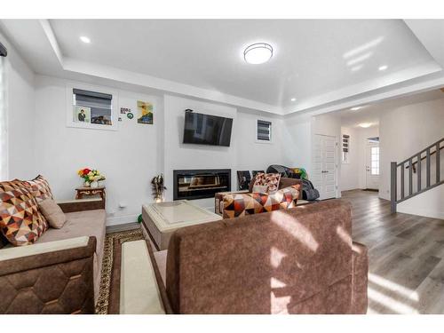 685 Windrow Manor Sw, Airdrie, AB - Indoor Photo Showing Living Room With Fireplace