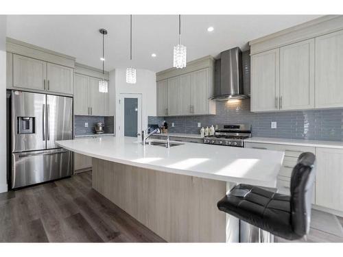 685 Windrow Manor Sw, Airdrie, AB - Indoor Photo Showing Kitchen With Stainless Steel Kitchen With Double Sink With Upgraded Kitchen