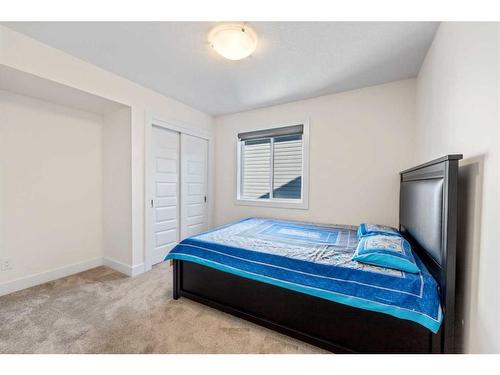 685 Windrow Manor Sw, Airdrie, AB - Indoor Photo Showing Bedroom