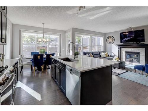 75 Nolanfield Court Nw, Calgary, AB - Indoor Photo Showing Kitchen With Fireplace With Double Sink With Upgraded Kitchen