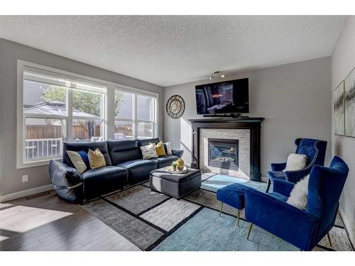 75 Nolanfield Court Nw, Calgary, AB - Indoor Photo Showing Living Room With Fireplace