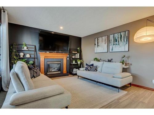 144 Springmere Road, Chestermere, AB - Indoor Photo Showing Living Room With Fireplace