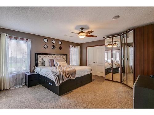 144 Springmere Road, Chestermere, AB - Indoor Photo Showing Bedroom