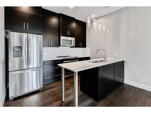 102-1808 27 Avenue Sw, Calgary, AB - Indoor Photo Showing Kitchen With Double Sink With Upgraded Kitchen