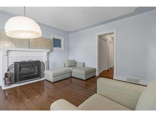 1405 24 Street Sw, Calgary, AB - Indoor Photo Showing Living Room With Fireplace