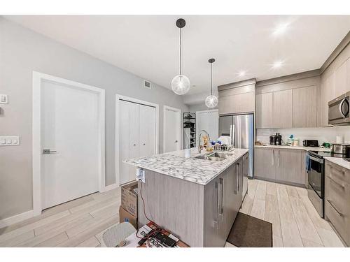 1408-681 Savanna Boulevard Ne, Calgary, AB - Indoor Photo Showing Kitchen With Stainless Steel Kitchen With Upgraded Kitchen