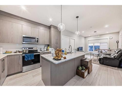 1408-681 Savanna Boulevard Ne, Calgary, AB - Indoor Photo Showing Kitchen With Stainless Steel Kitchen With Upgraded Kitchen