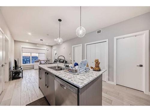 1408-681 Savanna Boulevard Ne, Calgary, AB - Indoor Photo Showing Kitchen With Double Sink