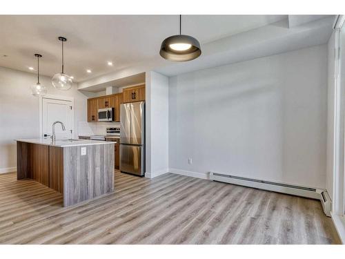 210-50 Sage Hill Walk Nw, Calgary, AB - Indoor Photo Showing Kitchen With Stainless Steel Kitchen With Upgraded Kitchen