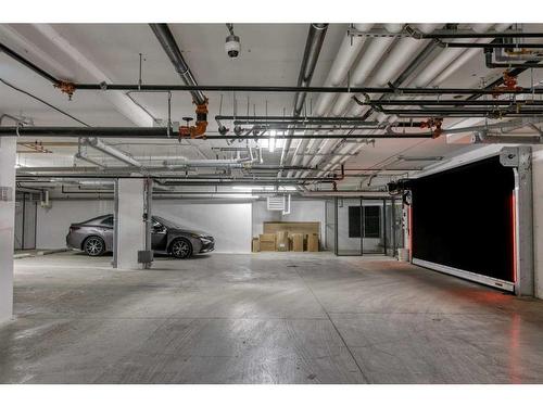 210-50 Sage Hill Walk Nw, Calgary, AB - Indoor Photo Showing Garage