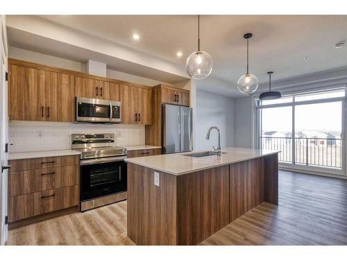 210-50 Sage Hill Walk Nw, Calgary, AB - Indoor Photo Showing Kitchen With Stainless Steel Kitchen With Upgraded Kitchen