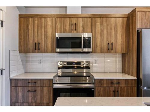 210-50 Sage Hill Walk Nw, Calgary, AB - Indoor Photo Showing Kitchen With Stainless Steel Kitchen