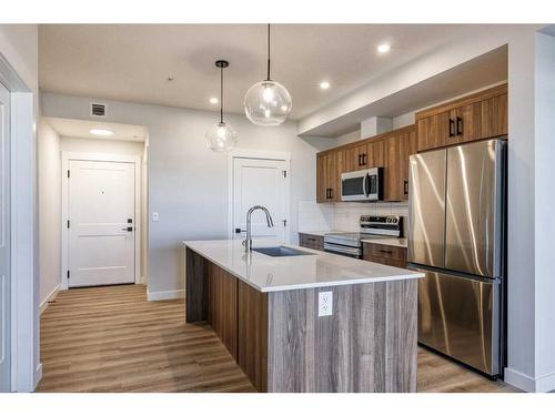 210-50 Sage Hill Walk Nw, Calgary, AB - Indoor Photo Showing Kitchen With Stainless Steel Kitchen With Upgraded Kitchen