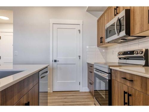 210-50 Sage Hill Walk Nw, Calgary, AB - Indoor Photo Showing Kitchen