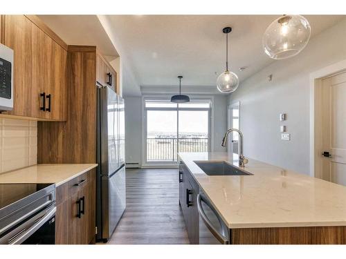 210-50 Sage Hill Walk Nw, Calgary, AB - Indoor Photo Showing Kitchen With Upgraded Kitchen