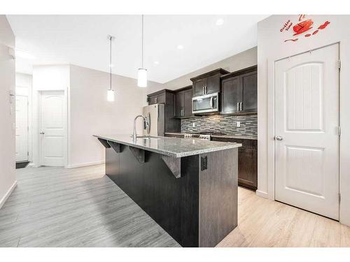 308 Cornergate Row Ne, Calgary, AB - Indoor Photo Showing Kitchen With Upgraded Kitchen