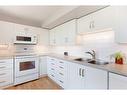 122-4525 31 Street Sw, Calgary, AB  - Indoor Photo Showing Kitchen With Double Sink 