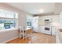 122-4525 31 Street Sw, Calgary, AB  - Indoor Photo Showing Kitchen With Double Sink 