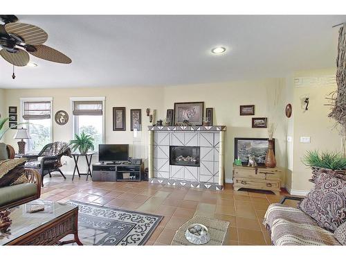 255046 Tsp Rd250 Road, Rural Wheatland County, AB - Indoor Photo Showing Living Room With Fireplace