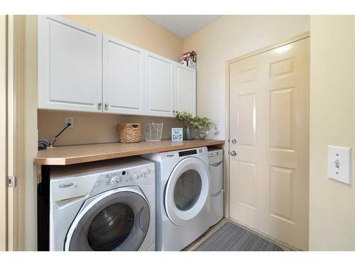 7787 Springbank Way Sw, Calgary, AB - Indoor Photo Showing Laundry Room